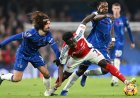 Merino bails out Arsenal as 10 men Chelsea push leaders to the brink at Stamford Bridge